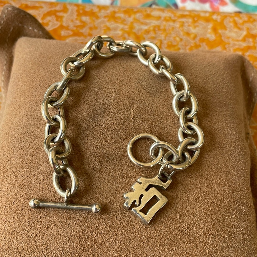 Sterling silver link bracelet with dangle charm